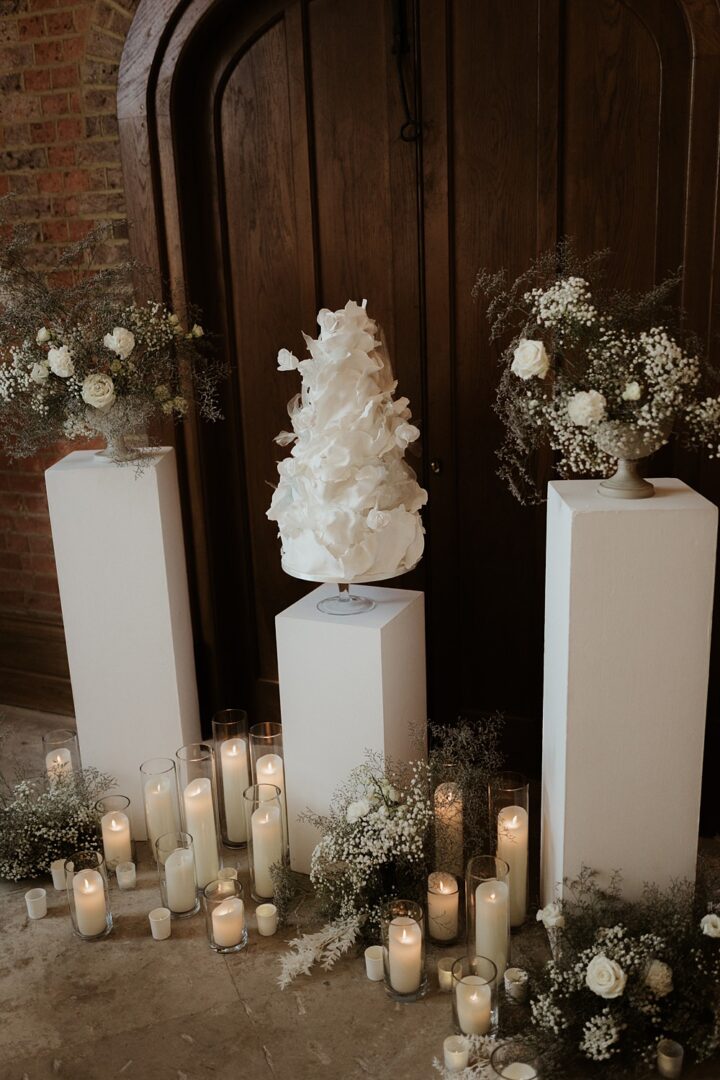 Wedding Cake Table Pillars Candles Natalie Silvester Photography