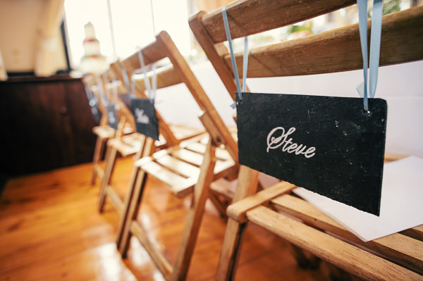 Colourful Homemade Village Hall Wedding Blackboard Chair Signs Decor http://hollydeacondesign.com/