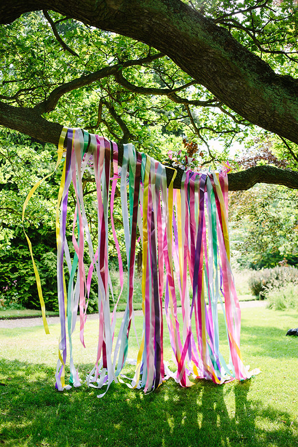 Ribbon Backdrop Colourful Outdoor Blooms Ribbons Wedding Ideas http://www.paperangelphotography.co.uk/ 
