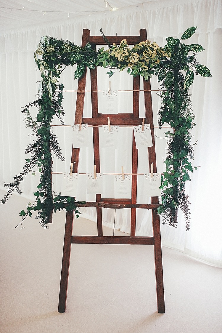 Laddver Foliage Stand Seating Table Chart Whimsical Green White Fairy Lights Winter Wedding http://jesspetrie.com/