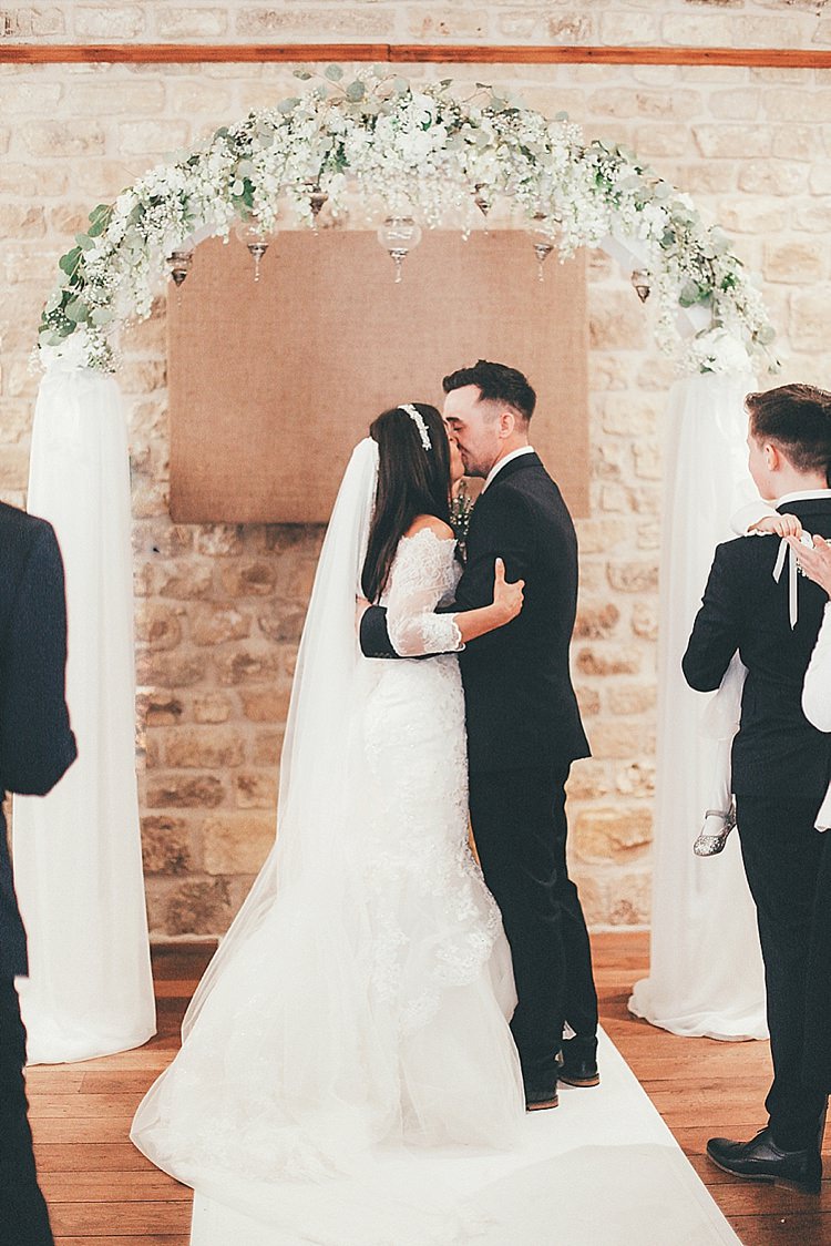 Ceremony Arch Flowers Tulle Whimsical Green White Fairy Lights Winter Wedding http://jesspetrie.com/