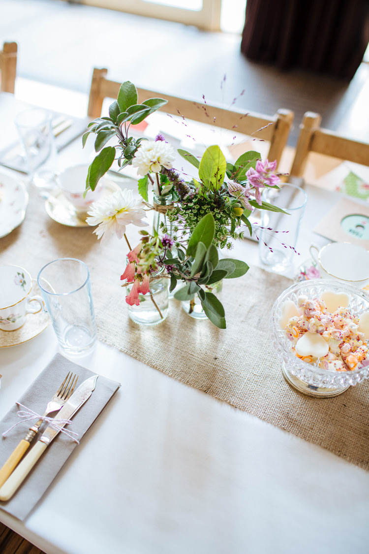Jar FLowers Hessian Table Centrepiece Pretty Quirky DIY Village Hall Wedding http://lauradebourdephotography.com/