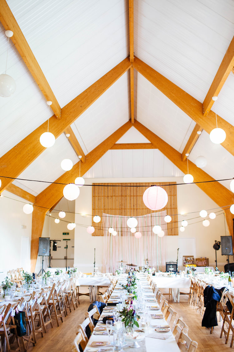 Light Lanterns Pretty Quirky DIY Village Hall Wedding http://lauradebourdephotography.com/