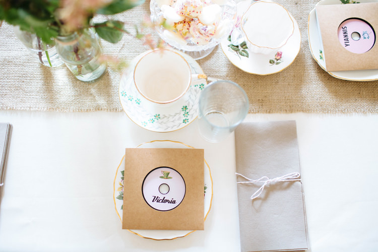 Tea Cups Vintage Record Place Setting Favours Pretty Quirky DIY Village Hall Wedding http://lauradebourdephotography.com/