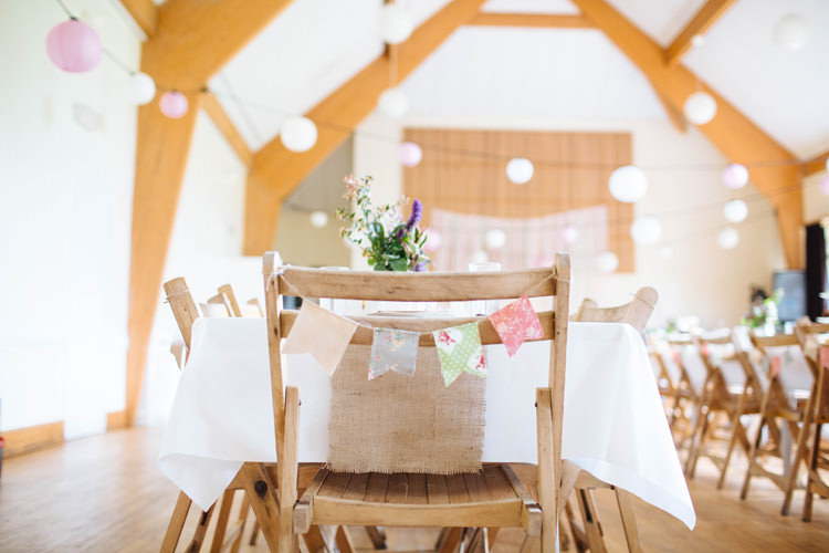 Chair Bunting Pretty Quirky DIY Village Hall Wedding http://lauradebourdephotography.com/