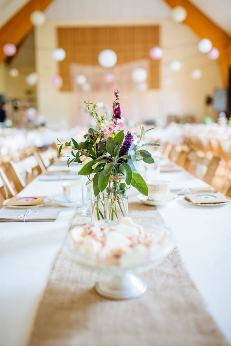 Jar Flowers Table Centrepiece Pretty Quirky DIY Village Hall Wedding http://lauradebourdephotography.com/