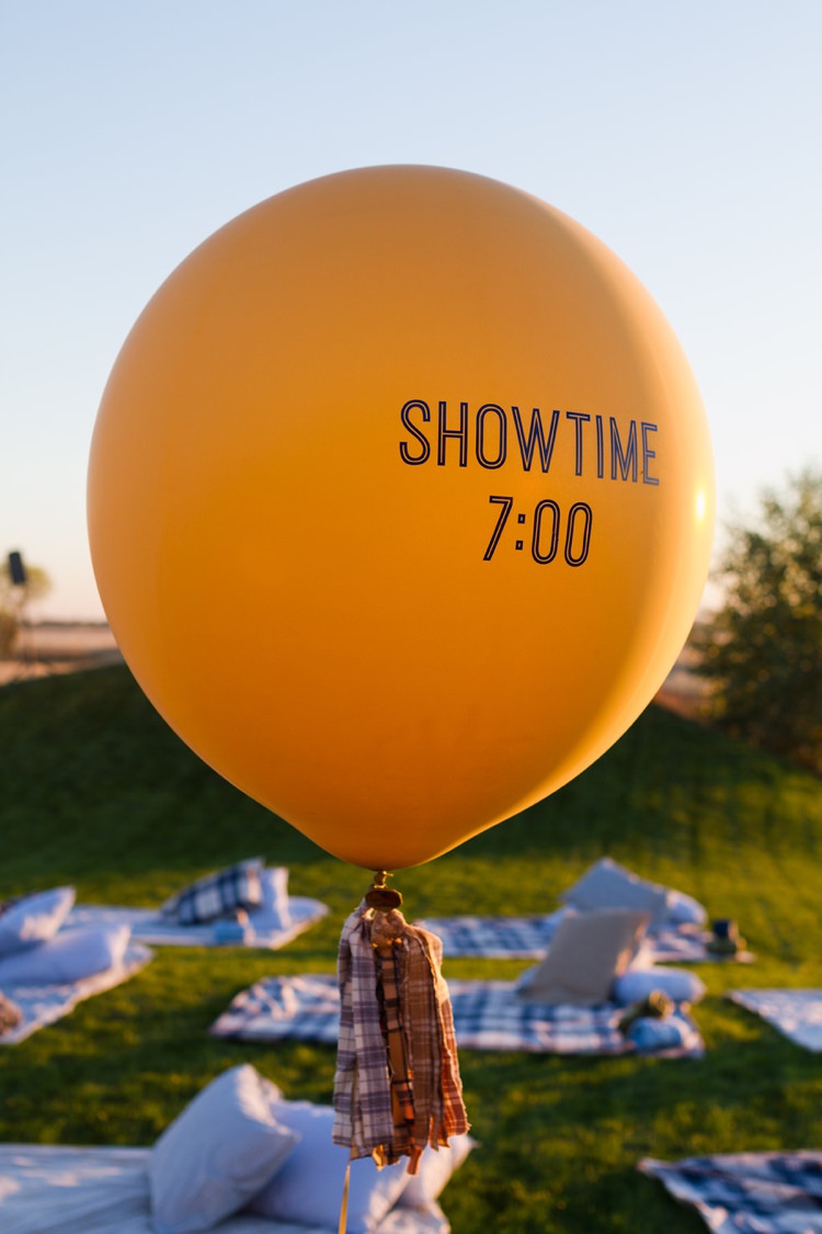 Balloons Tassells Surprise Outdoor Movie Night Double Engagement Party http://ranallaphotography.com/