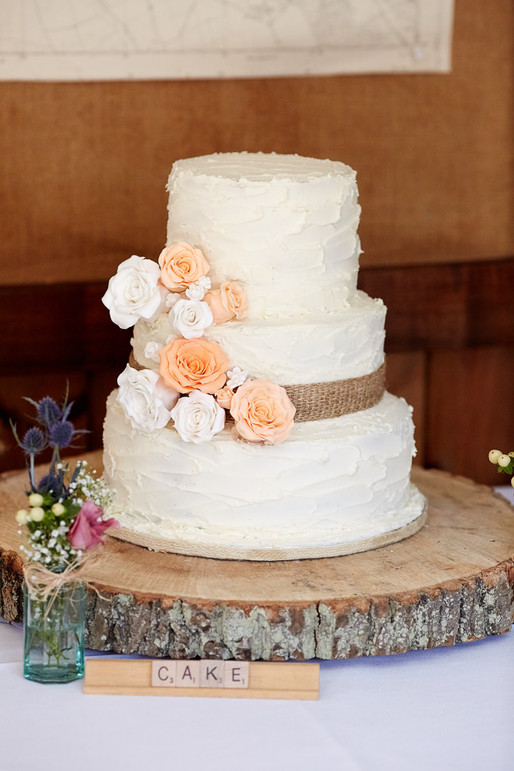 Icing Flowers Hessian Log Cake Quaint Rustic Seaside Windmill Wedding Norfolk http://www.fullerphotographyweddings.co.uk/
