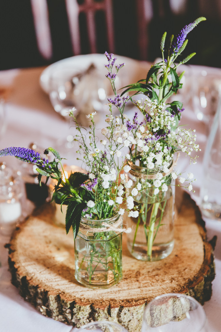 Wildflowers Centrepiece Log Jars Twine Purple White Relaxed Fun Rustic Countryside Barn Wedding http://www.paulunderhill.com/