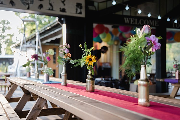 Picnic Tables Flowers Bottles Colourful Rainbow Gold Camp Wedding Party http://alexa-loy.com/