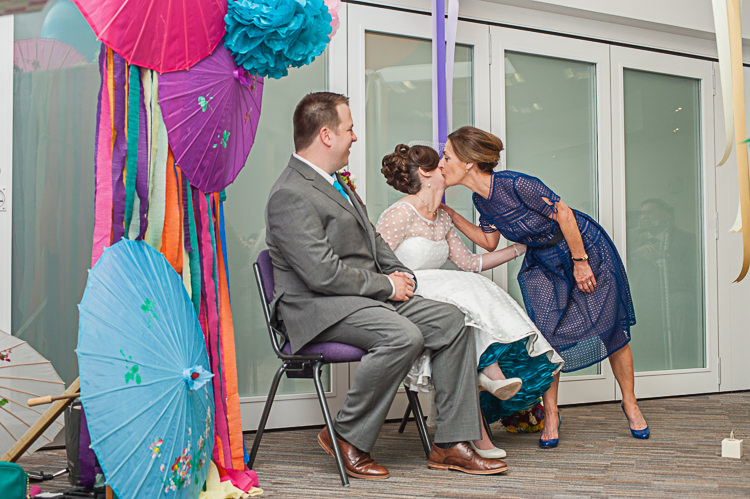 Umbrella Ribbons Backdrop Riverside DIY Colourful Wedding http://www.robfarrellphotography.uk/
