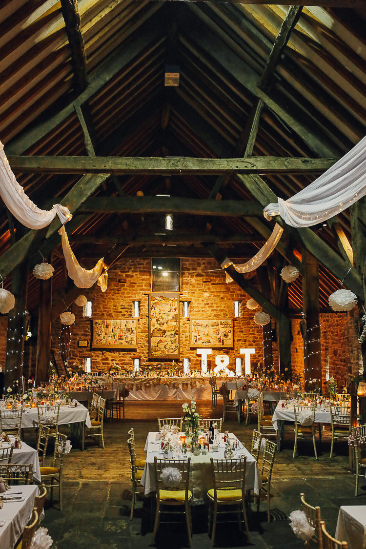 The Manorial Barn Drapes Fairy Lights Pom Poms Stylish Pastel Rustic Barn Wedding http://helenrussellphotography.co.uk/ 