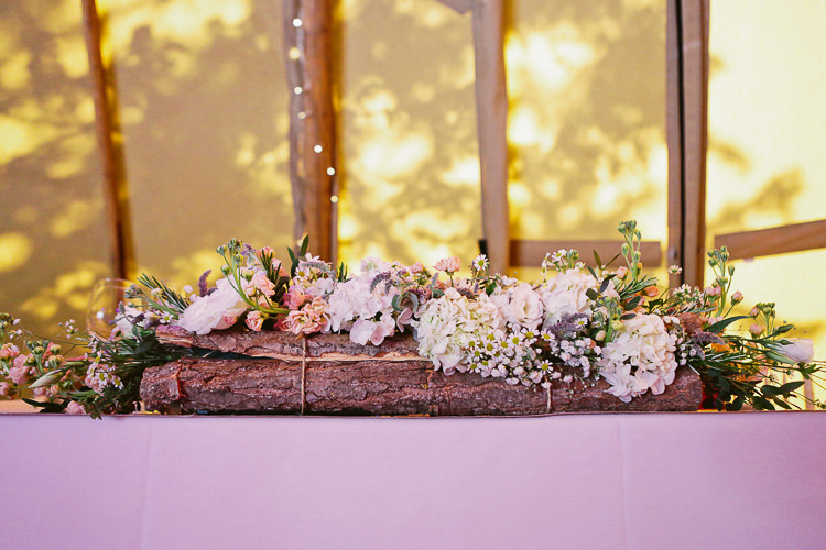 Log Flower Bark Tree Top Table Arrangement Rustic Laid Back Tipi Wedding http://helenrussellphotography.co.uk/