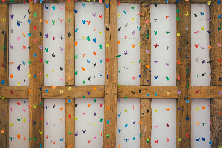 Origami Paper Cranes Backdrop Local DIY Yellow Barn Wedding http://www.brettsymesphotography.co.uk/