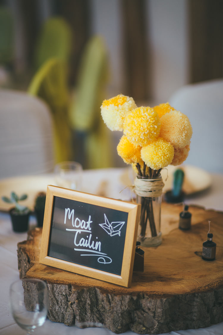 Pom Pom Wool Flowers Centrepiece Decor Jar Log Local DIY Yellow Barn Wedding http://www.brettsymesphotography.co.uk/