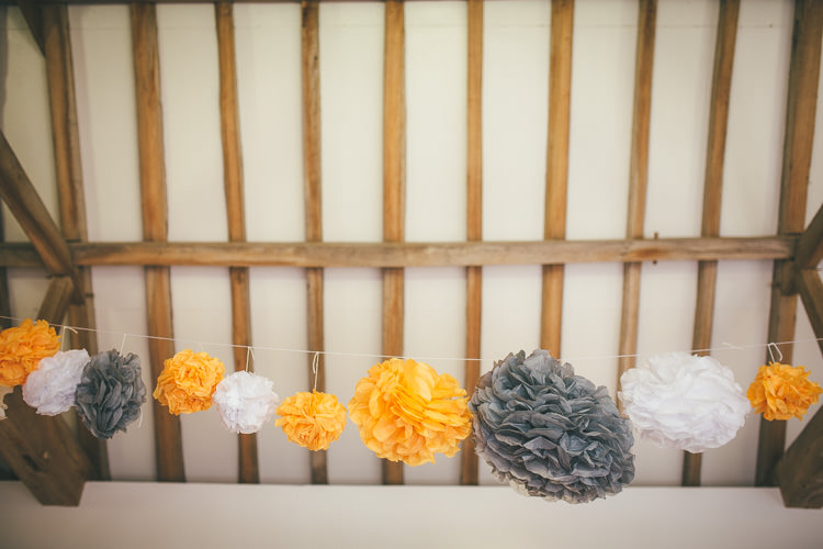 Pom Poms Paper Grey Local DIY Yellow Barn Wedding http://www.brettsymesphotography.co.uk/