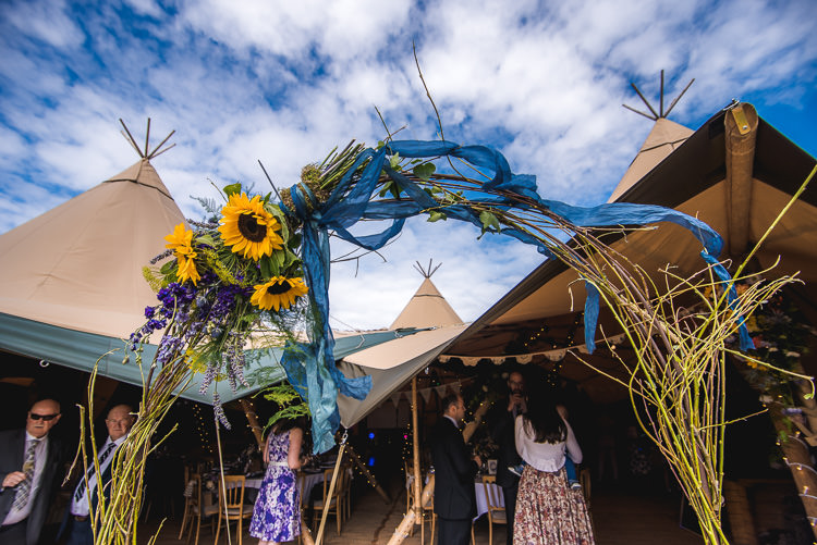 Floral Flower Arch Mismatched Farm Tipi Wedding http://www.andrewkeher.co.uk/