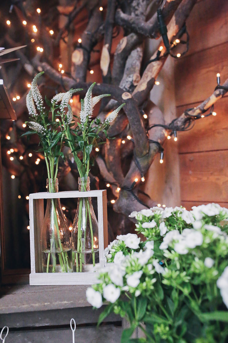 White Bottle Flowers Rustic Treehouse Wedding http://helenrussellphotography.co.uk/