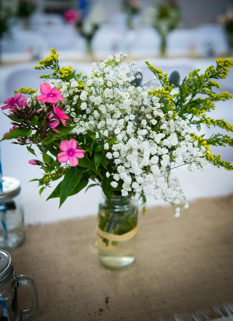 Jar Flowers Raffia Colourful DIY Village Fete Wedding http://jamesgristphotography.co.uk/blog/
