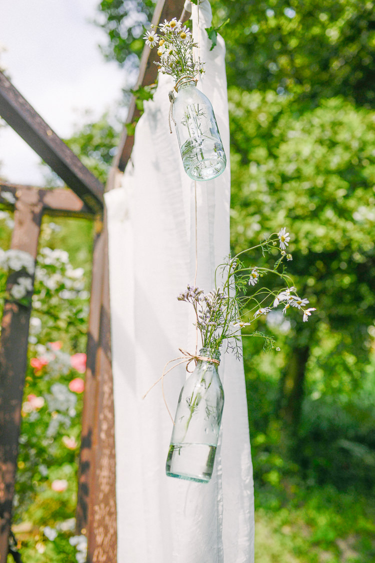 Hanging Bottle Flowers Backdrop Intimate Italian Rose Garden Wedding http://landvphotography.it/