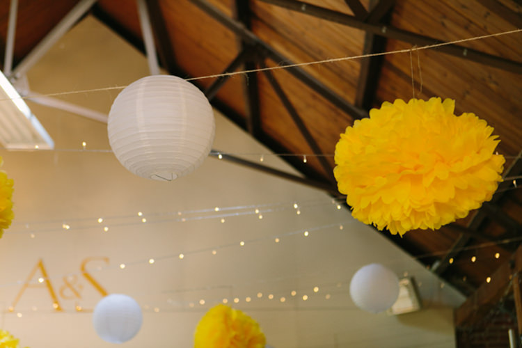 Pom Poms Lanterns Fairy Lights Crafty Yellow Vintage Village Hall Wedding http://www.suekwiatkowska.com/