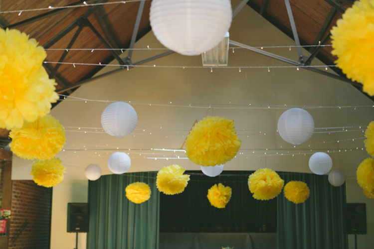 Pom Poms Lanterns Fairy Lights Crafty Yellow Vintage Village Hall Wedding http://www.suekwiatkowska.com/