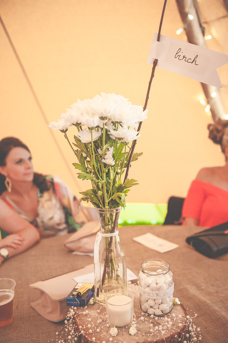 White Flowers Bottle Log Centrepiece Quirky Natural Woodland Wedding http://lisahowardphotography.co.uk/