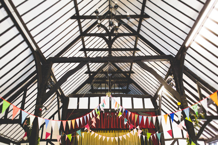 Mulit Coloured Bunting Autumn Kentish Village Hall Wedding http://www.livvy-hukins.co.uk/