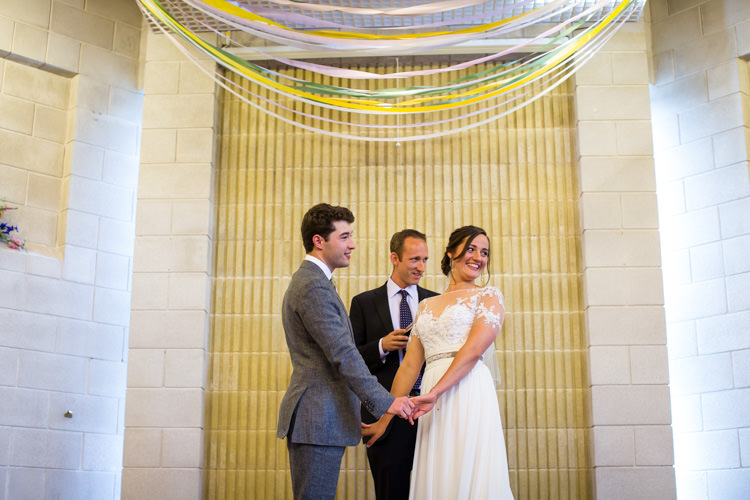 Streamer Ribbons Backdrop Ceremony Colourful DIY Village Hall Wedding http://samanthagilrainephotography.com/