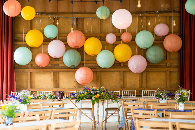 Lantern Backdrop Wild Flowers Colourful DIY Village Hall Wedding http://samanthagilrainephotography.com/