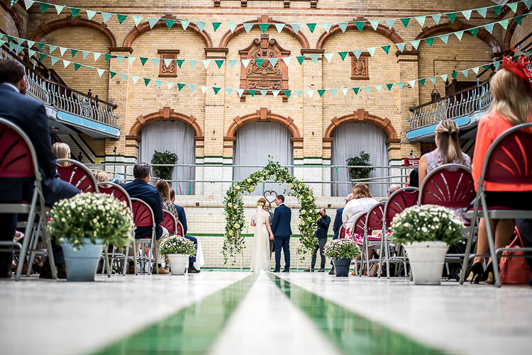 Floral Arch Bunting Quirky Film DIY Wedding http://jamestraceyphotography.com/