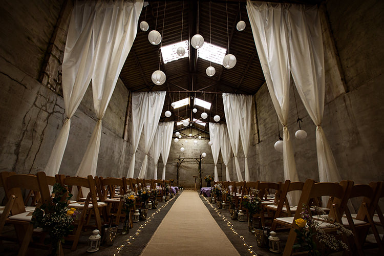Ceremony Barn Backdrop Arch Lanterns Fabric Drapes Fairy Lights Home Made Farm Tipi Wedding http://alexabbottphotography.co.uk/