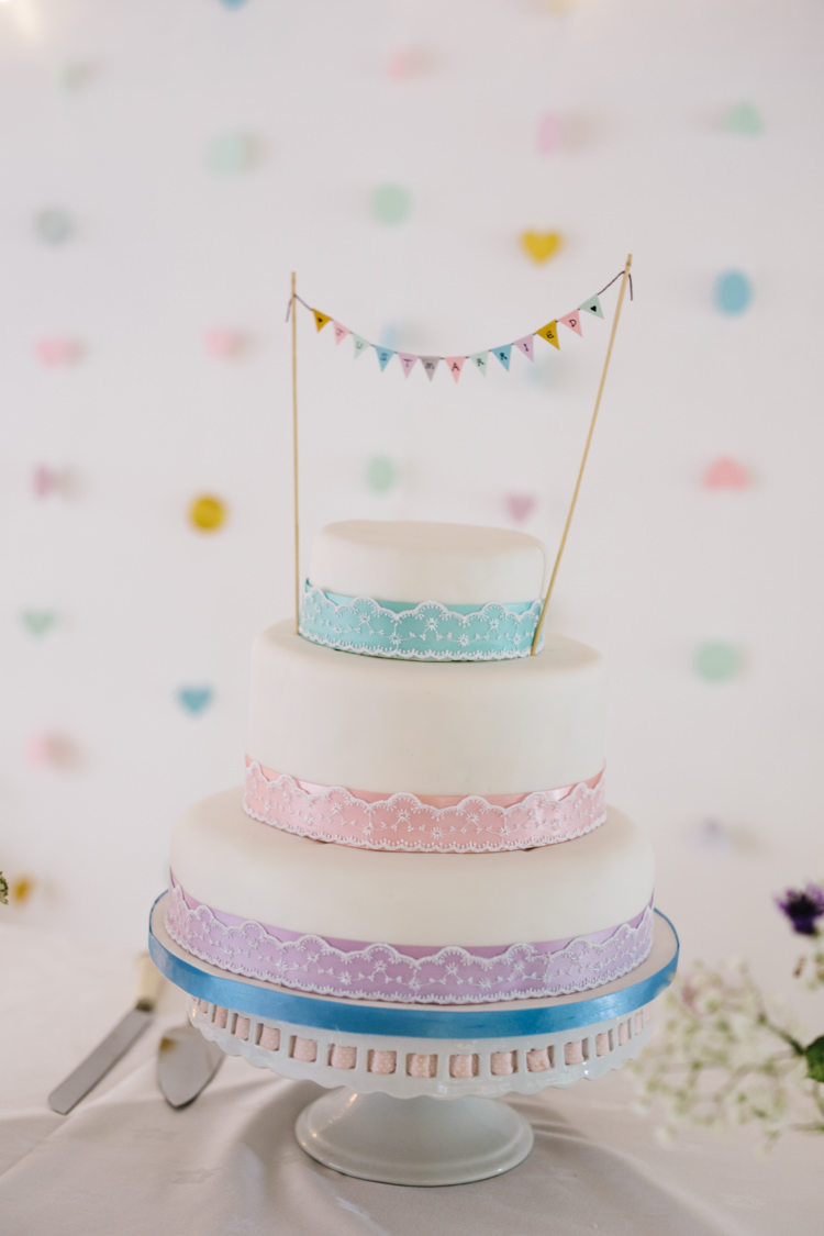 Ribbons Bunting Cake Relaxed DIY Pastel Wedding http://www.honeyandthemoonphotography.co.uk/