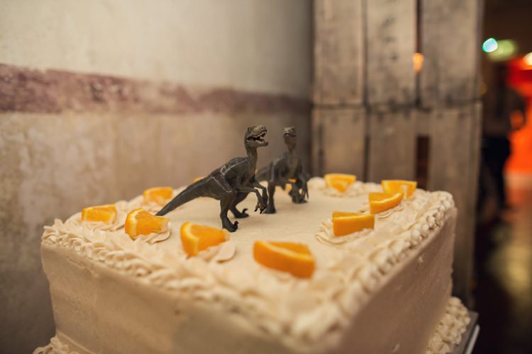 Toy Dinosaur Cake Topper Bright Fun Pink Peonies Wedding http://assassynation.co.uk/