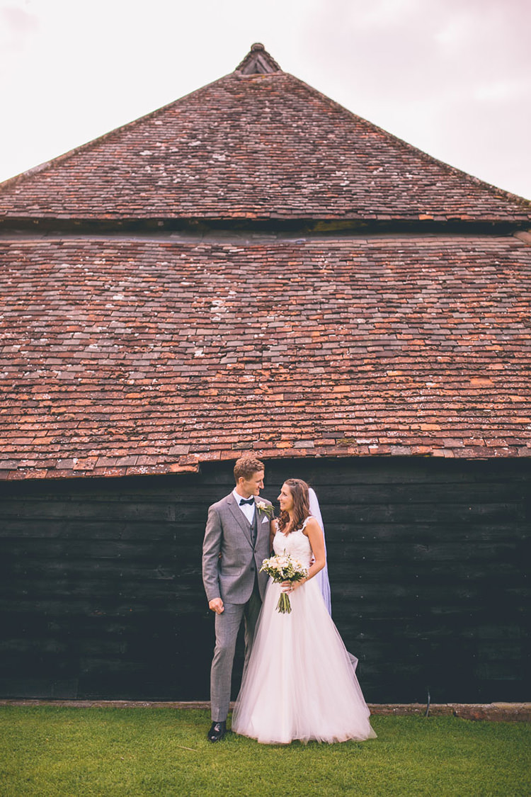 Grey Suit Black Bow Tie Groom Origami Books Barn Wedding http://storyandcolour.co.uk/
