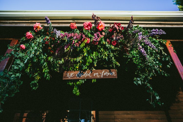 Flower Arch Wooden Sign Rustic Ceremony Whimsical Barn Wedding Australia http://throughthewoodsweran.co.uk/