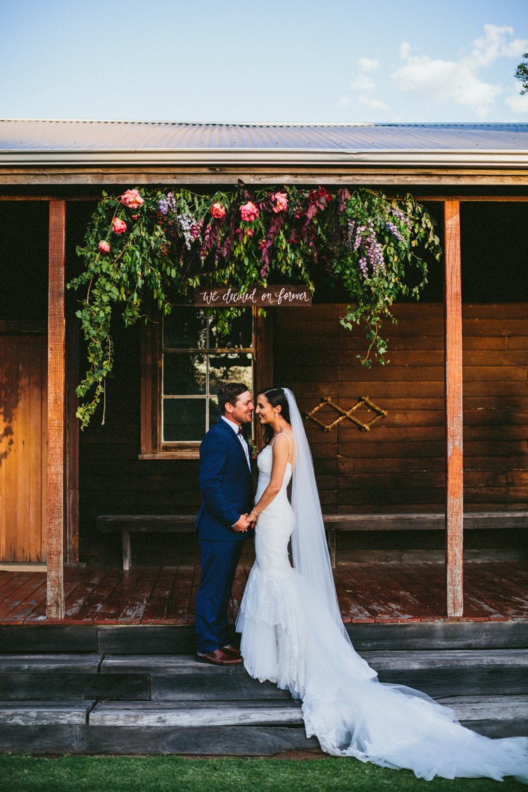 Flower Arch Ceremony Wooden Sign Whimsical Barn Wedding Australia http://throughthewoodsweran.co.uk/