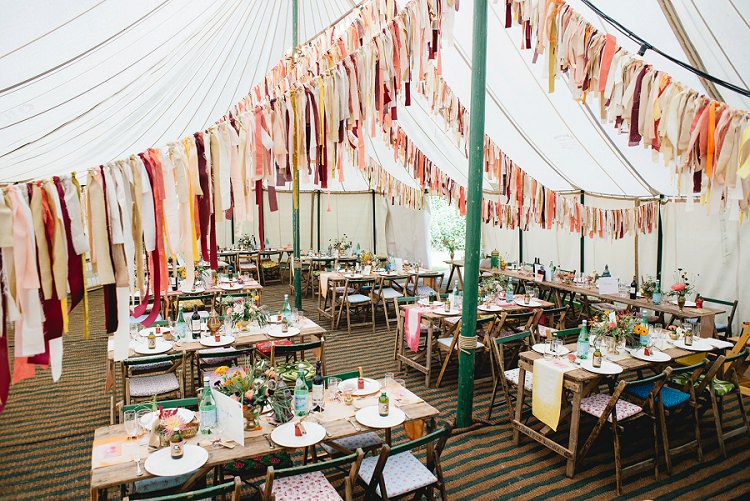 Pole Tent Marquee Rag Bunting Orange Coral Rustic Tables Laid Back Bohemian Festival Wedding http://benjaminmathers.co.uk/