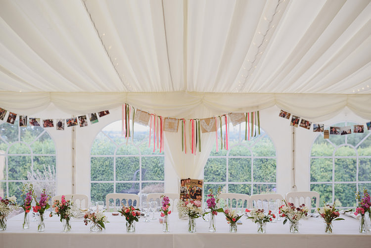 Top Table Photo Bunting Decoration Pink Flowers Fun Outdoorsy Farm Wedding http://www.samgibsonweddings.co.uk/