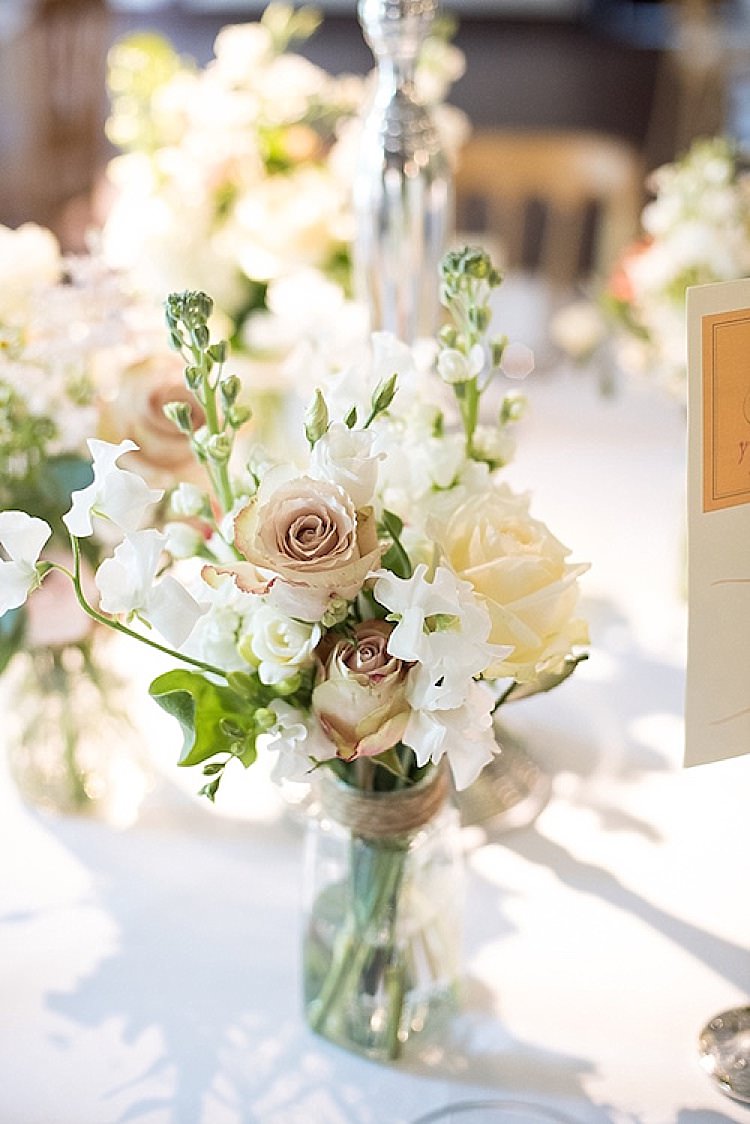 Jar Flowers White Twine Roses Beautiful Country House Wedding http://www.fionasweddingphotography.co.uk/