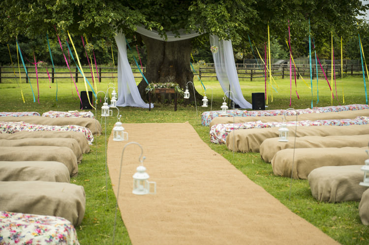 Ceremony Aisle Ribbons Tree Hay Bales Hessian Lanterns Fun Glittery Outdoor Colourful Wedding http://www.reportography.com/