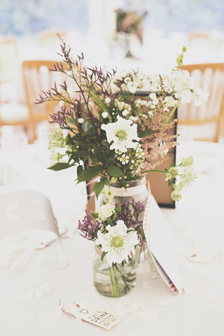 Flowers Jars Centrepiece Tables Stylish Relaxed Fun Marquee Wedding http://www.bennicarolweddingphotography.com/
