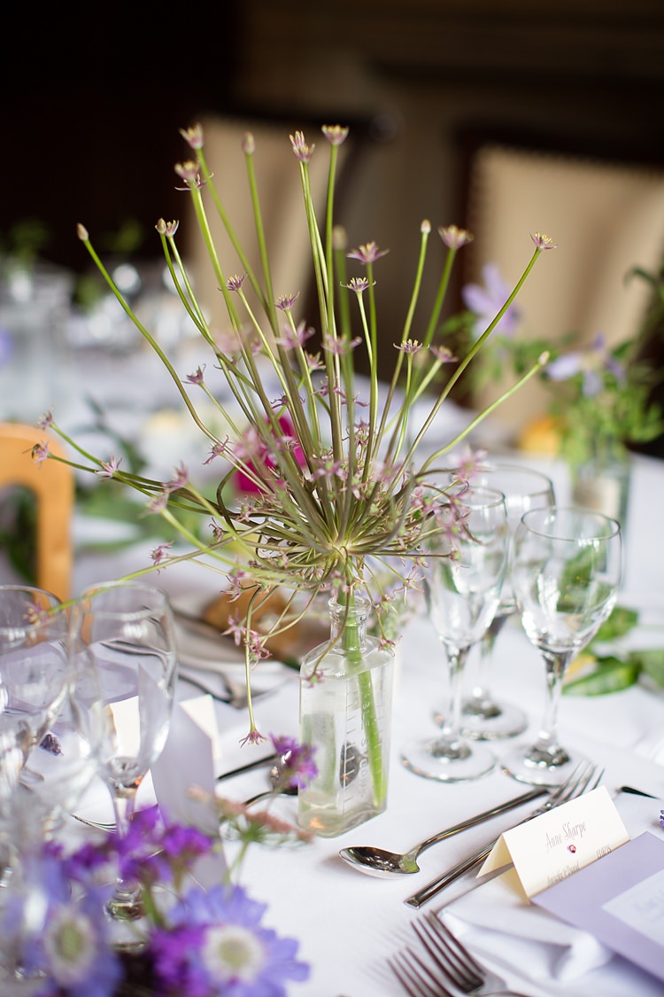 Glass Bottle Flowers Natural Ethereal Purple Wedding http://www.katherineashdown.co.uk/
