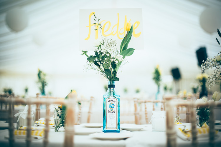 Gin Bottle Flowers Centrepiece Decor Meadow Marquee Home Made Wedding http://www.faircloughphotography.co.uk/