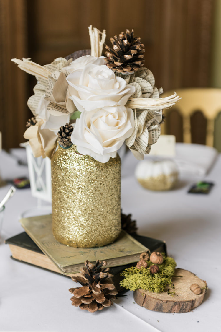 Paper Flowers Pine Cones Glitter Centrepiece Decor Books Glamorous Gold Halloween Wedding http://www.oliviajohnstonweddings.co.uk/