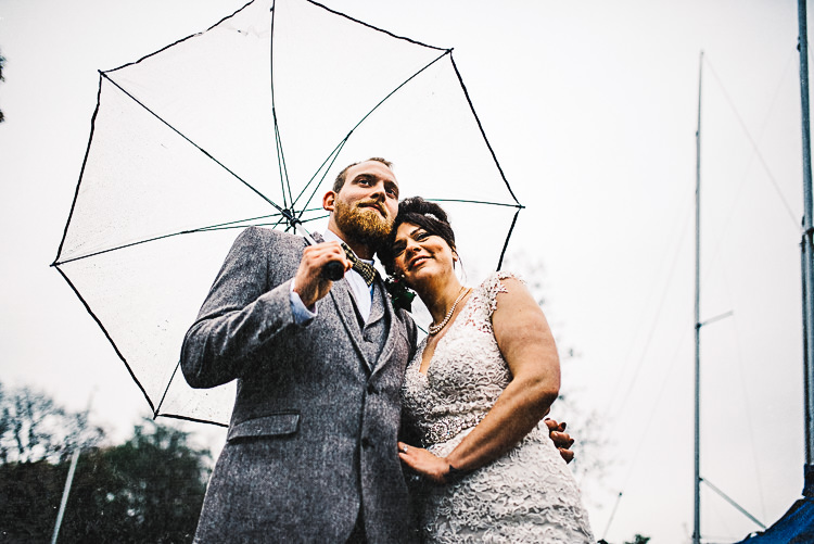 Umbrella Rainy Bride Grooom Relaxed Quirky Sailing Club Wedding http://www.stevebridgwoodphotography.co.uk/