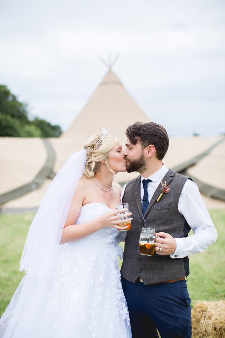 Jar Drinks Tipi Pimms Bride Groom Family Farm Festival Wedding https://amylouphotography.co.uk/