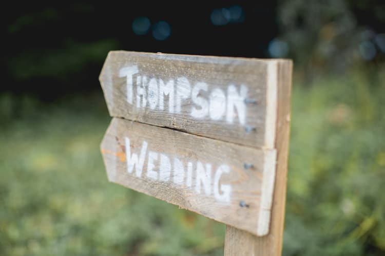 Wooden Rustic Sign Post Family Farm Festival Wedding https://amylouphotography.co.uk/