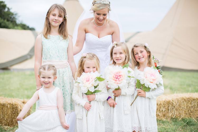 Flower Girls White Dresses Giant Paper Flowers Family Farm Festival Wedding https://amylouphotography.co.uk/