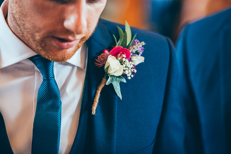 Buttonhole Groom Red White Festival Barn Teal Wedding http://www.faircloughphotography.co.uk/